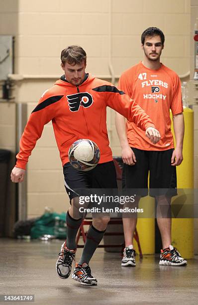 Matt Read and Eric Wellwood of the Philadelphia Flyers play soccer prior to their game against the New Jersey Devils in Game Two of the Eastern...