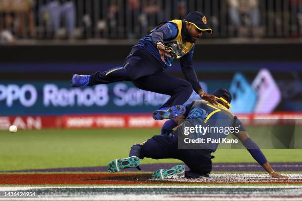 Wanindu Hasaranga of Sri Lanka leaps over Dasun Shanaka after a missed catch during the ICC Men's T20 World Cup match between Australia and Sri Lanka...