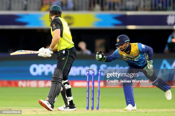 Kusal Mendis of Sri Lanka attempts to run out Mitch Marsh of Australia during the ICC Men's T20 World Cup match between Australia and Sri Lanka at...