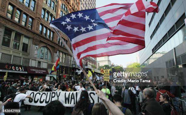 Protesters affiliated with Occupy Wall Street march down Broadway in Manhattan towards Wall Street on May 1, 2012 in New York City. Occupy Wall...