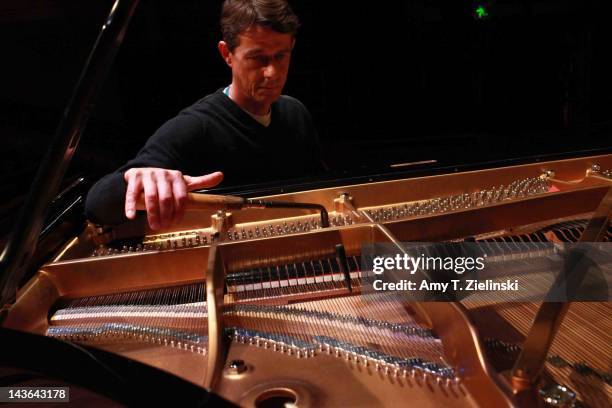 Southbank Centre's Concert piano technician John Heard tunes the Steinway concert grand piano before Chinese classical pianist Yuja Wang performs on...