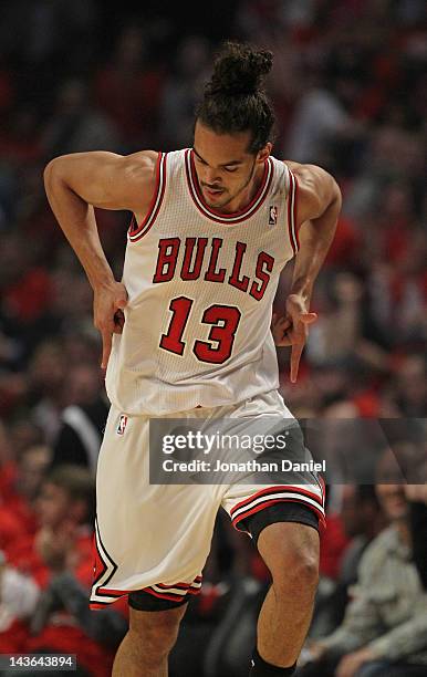 Joakim Noah of the Chicago Bulls celebrates hitting a shot against the Philadelphia 76ers in Game Two of the Eastern Conference Quarterfinals during...