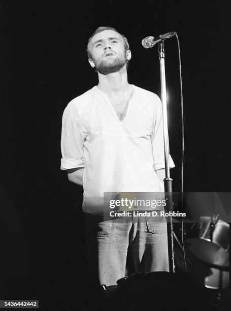 Genesis drummer Phil Collins takes center stage to sing "More Fool Me" during a 1974 concert in New York City, 6 May 1974.