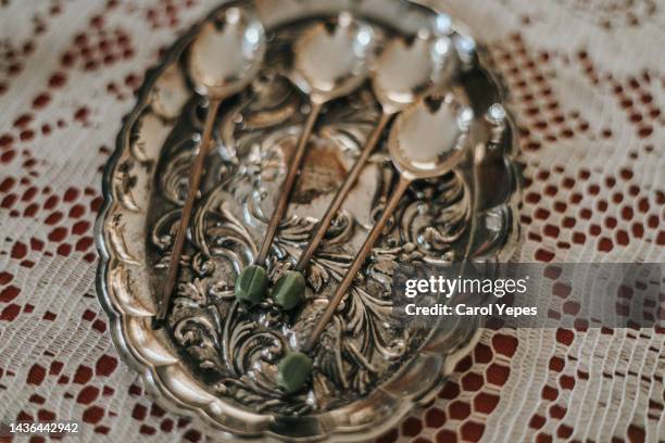antique silver spoons and fork on vintage tray - pewter stock pictures, royalty-free photos & images