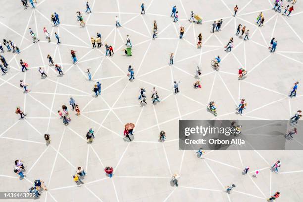 aerial view of crowd connected by lines - rede imagens e fotografias de stock