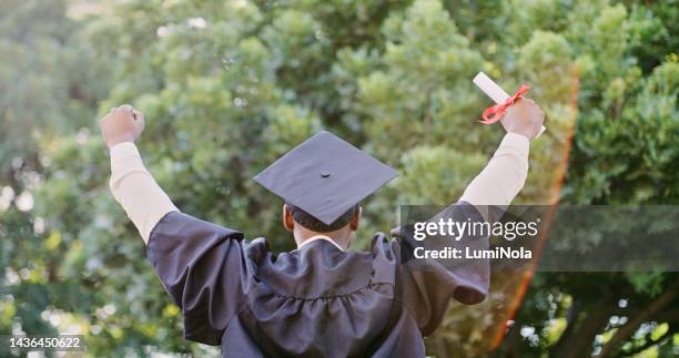 graduate, success and education, celebrate graduation with certificate and pride for achievement. winner, fist and academic event, degree with college diploma and happiness outdoors in cap and gown. - scholarship award stock pictures, royalty-free photos & images