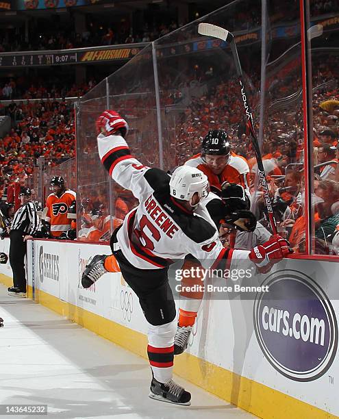 Brayden Schenn of the Philadelphia Flyers hits Andy Greene of the New Jersey Devils during the second period in Game Two of the Eastern Conference...