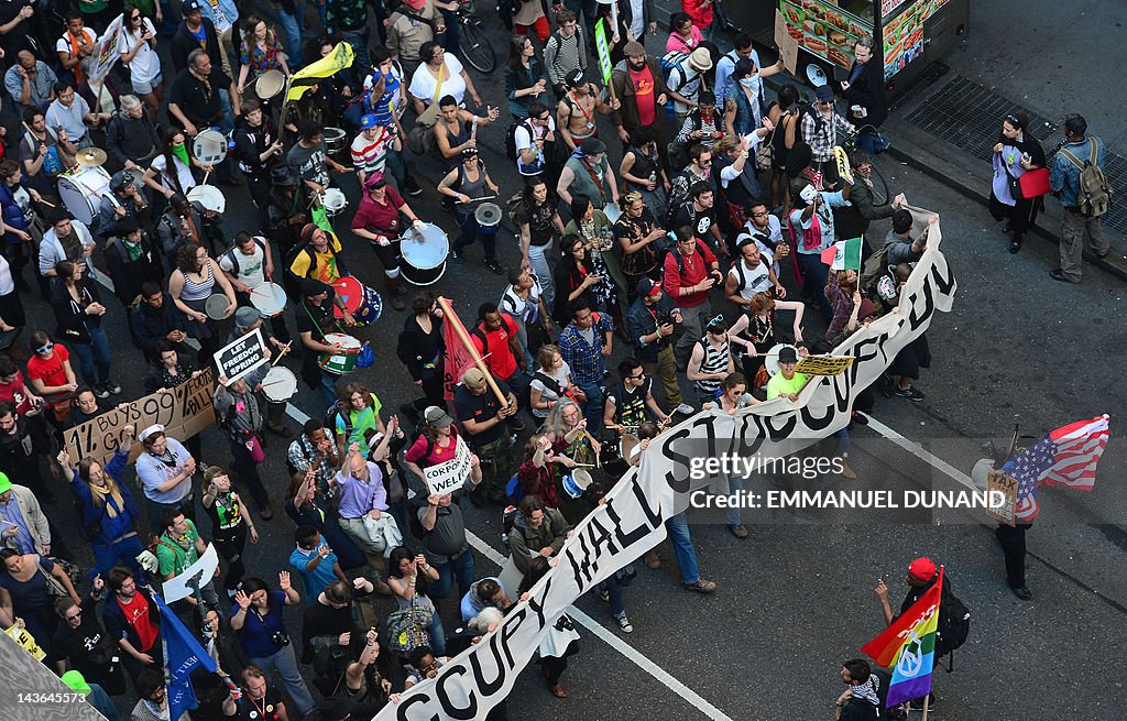 Occupy Wall Street participants stage a 