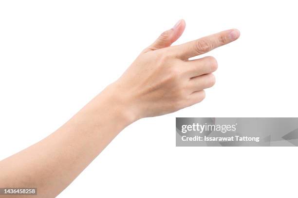 female's hand touching or pointing to something isolated on white background. close up. high resolution. - doigts photos et images de collection