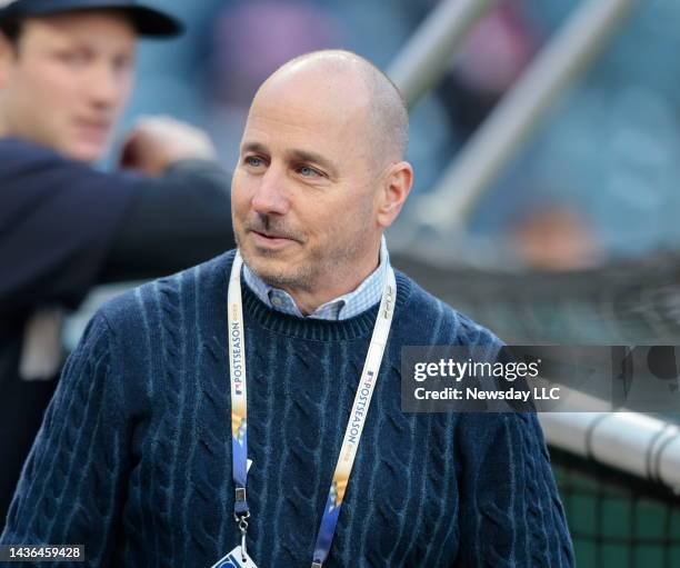 Yankees General Manager Brian Cashman attends the team's batting practice before Game 3 of the American League Division Series at Progressive Field...