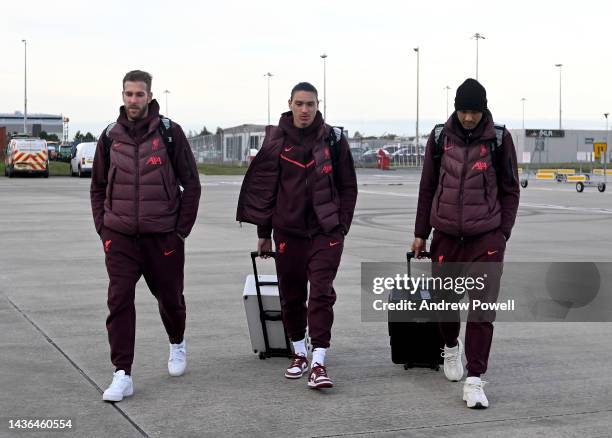 Adrian, Darwin Nunez and Fabinho of Liverpool departing ahead of their UEFA Champions League group a match between AFC Ajax and Liverpool at...