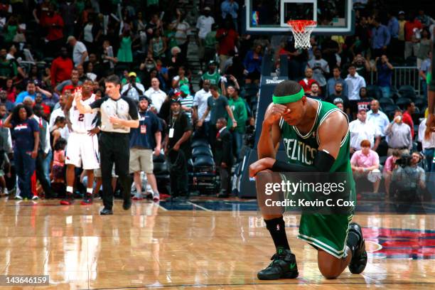 Paul Pierce of the Boston Celtics drops to one knee after their 87-80 win over the Atlanta Hawks in Game Two of the Eastern Conference Quarterfinals...