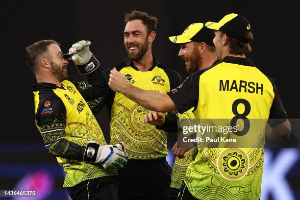 Matthew Wade, Glenn Maxwell, Aaron Finch and Mitchell Marsh of Australia celebrate the wicket of Dasun Shanaka of Sri Lanka during the ICC Men's T20...