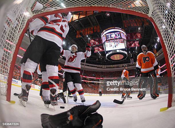 David Clarkson of the New Jersey Devils scores the game winning goal at 11:17 of the third period and is joined by Patrik Elias in the game against...