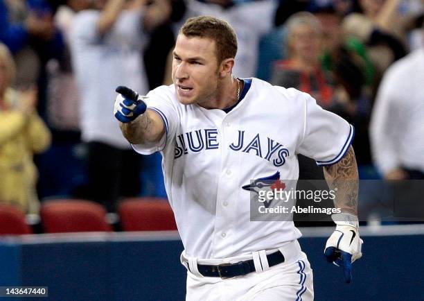 Brett Lawrie of the Toronto Blue Jays celebrates his game-winning home run in the 9th inning against the Texas Rangers during MLB action at the...