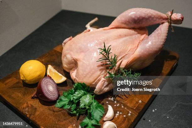 uncooked chicken on a board - raw turkey stock pictures, royalty-free photos & images
