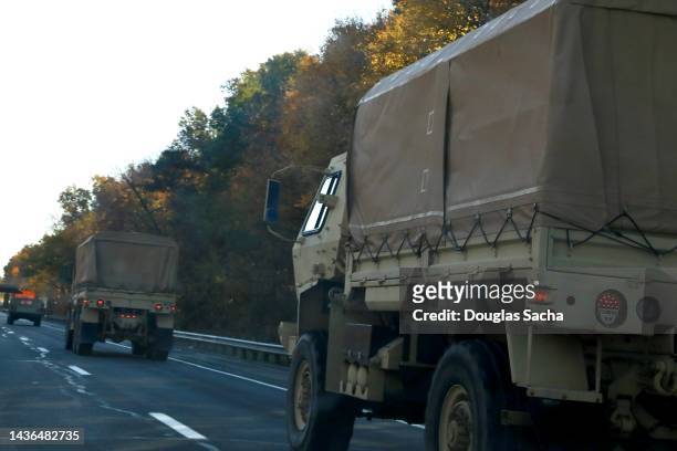 military vehicle convoy on a highway - national guard stock pictures, royalty-free photos & images