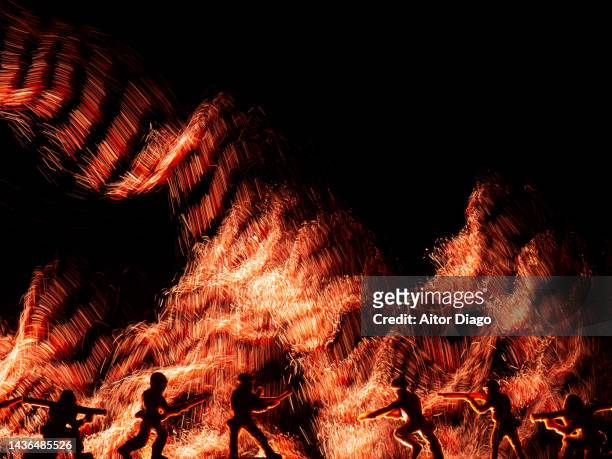 one group of soldiers(figurines)  fights against another. there is explosions in the background.  war concept. - self defence stock pictures, royalty-free photos & images