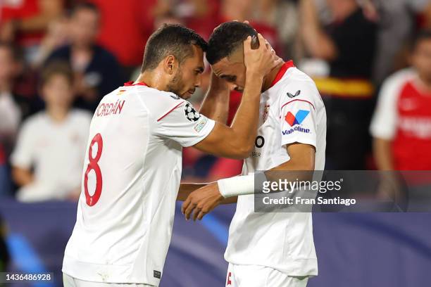 Yousseff En-Nesyri celebrates with teammate Joan Jordan of Sevilla FC after scoring their team's first goal during the UEFA Champions League group G...