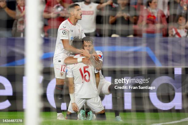 Yousseff En-Nesyri of Sevilla FC celebrates with teammates after scoring their team's first goal during the UEFA Champions League group G match...