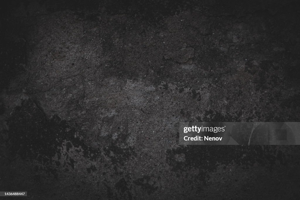 Dark vignette image of a cement wall