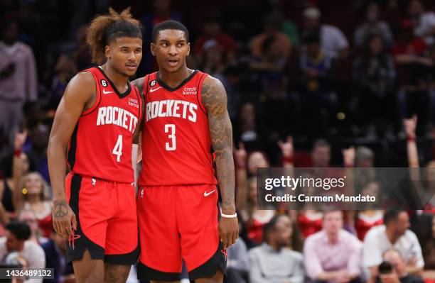 Jalen Green and Kevin Porter Jr. #3 of the Houston Rockets talk during a time out during the second half against the Utah Jazz at Toyota Center on...