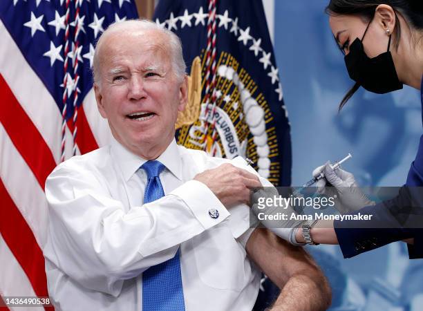 President Joe Biden receives his updated COVID-19 booster in the South Court Auditorium at the White House campus on October 25, 2022 in Washington,...