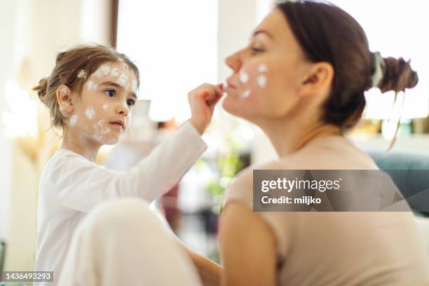 girl with chickenpox at last stage sitting at home in quarantine - chickenpox stock pictures, royalty-free photos & images