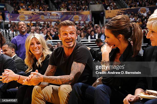 Soccer star David Beckham and his wife Victoria attend a game between the Denver Nuggets and the Los Angeles Lakers in Game Two of the Western...