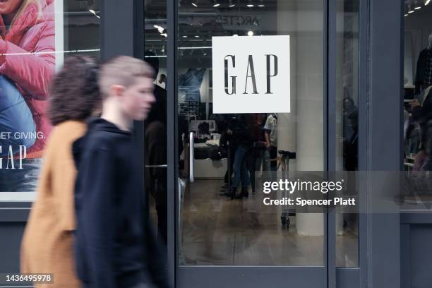 Gap store stands in Manhattan on October 25, 2022 in New York City. Gap Inc. Has reportedly joined the sporting goods brand Adidas in terminating its...