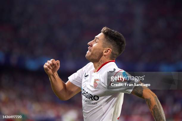 Gonzalo Montiel of Sevilla celebrates scoring their teams third goal with team mates during the UEFA Champions League group G match between Sevilla...