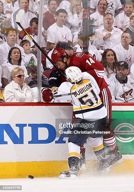 Francis Bouillon of the Nashville Predators lays a body check on Taylor Pyatt of the Phoenix Coyotes in Game One of the Western Conference Semifinals...