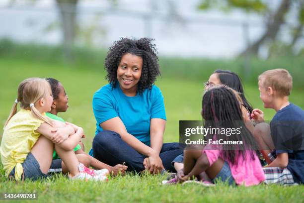 camp counselor with children - development camp stock pictures, royalty-free photos & images