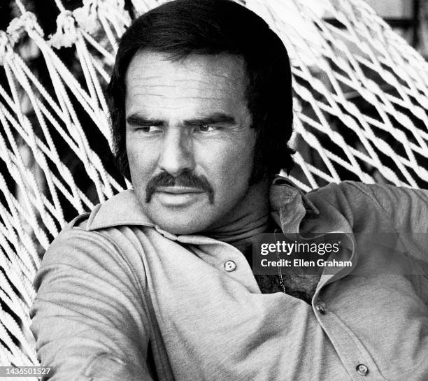 Portrait of American actor Burt Reynolds as he reclines in a hammock, Los Angeles, California, 1973.