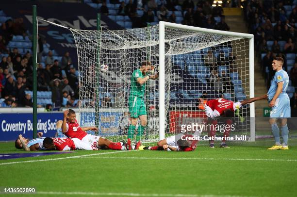Wes Harding of Rotherham United and team mates go down injured after a shot at goal during the Sky Bet Championship between Coventry City and...