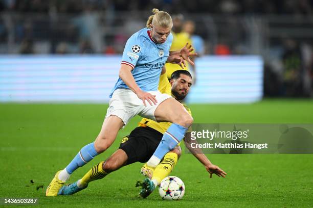 Emre Can of Borussia Dortmund battles for possession with Erling Haaland of Manchester City during the UEFA Champions League group G match between...