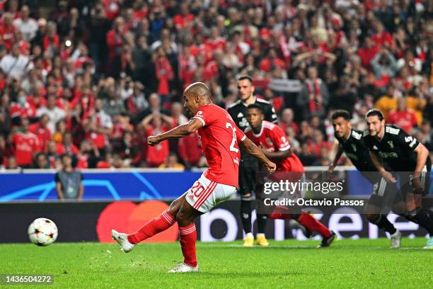 Joao Mario of Benfica scores their team's second goal from the penalty spot during the UEFA Champions League group H match between SL Benfica and...