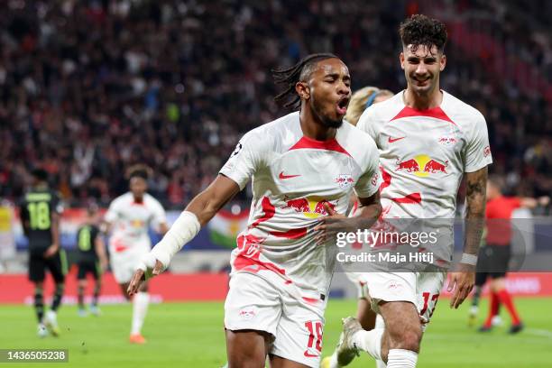 Christopher Nkunku of RB Leipzig celebrates scoring their side's second goal with teammates during the UEFA Champions League group F match between RB...