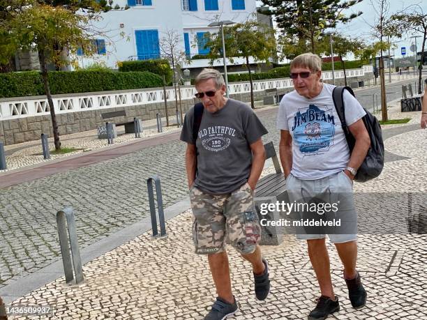 senior men alone in faro - look alike stock pictures, royalty-free photos & images