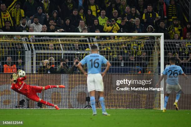 Riyad Mahrez of Manchester City has a penalty saved by Gregor Kobel of Borussia Dortmund during the UEFA Champions League group G match between...