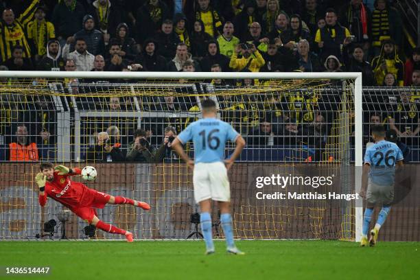 Riyad Mahrez of Manchester City has a penalty saved by Gregor Kobel of Borussia Dortmund during the UEFA Champions League group G match between...