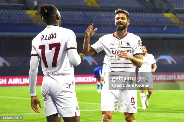 Rafael Leao celebrates with Olivier Giroud of AC Milan after their side's fourth goal during the UEFA Champions League group E match between Dinamo...