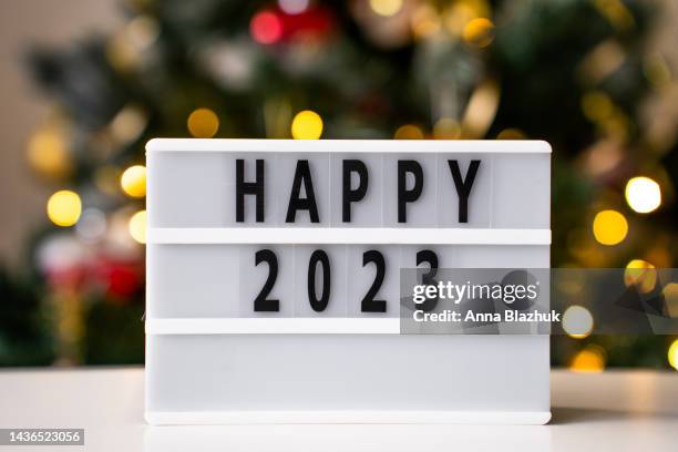 happy 2023 new year symbol, blurred lights in background - ljuslåda bildbanksfoton och bilder