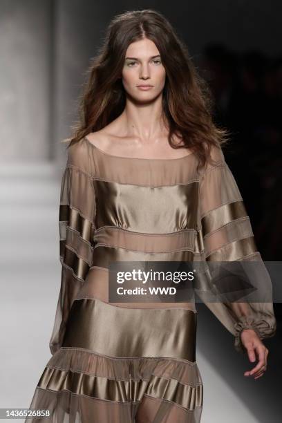 Model on the runway at Alberta Ferretti's spring 2011 show.