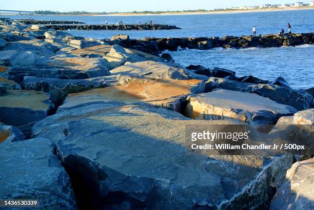 high angle view of rocks on beach,atlantic city,new jersey,united states,usa - atlantic city new jersey stock pictures, royalty-free photos & images
