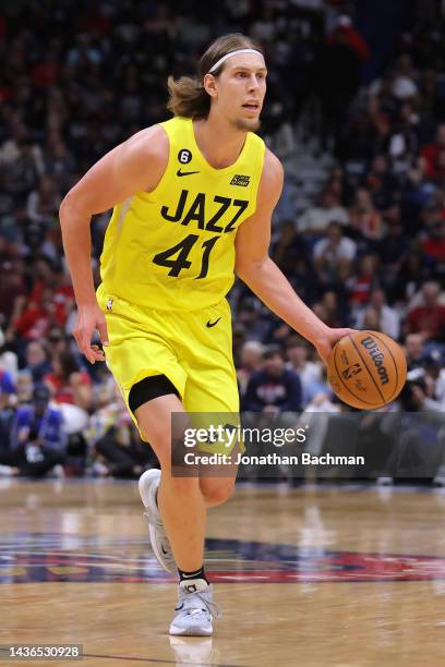 Kelly Olynyk of the Utah Jazz drives with the ball against the New Orleans Pelicans during a game at the Smoothie King Center on October 23, 2022 in...