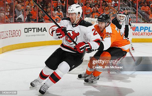 Marek Zidlicky of the New Jersey Devils in action against James van Riemsdyk of the Philadelphia Flyers in Game One of the Eastern Conference...
