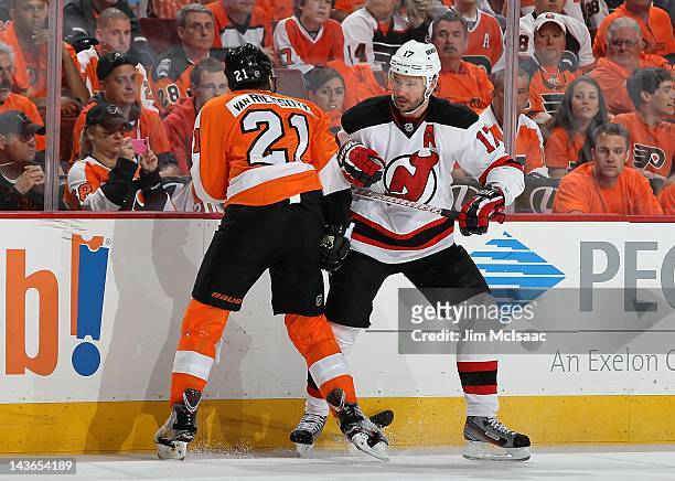 Ilya Kovalchuk of the New Jersey Devils in action against James van Riemsdyk of the Philadelphia Flyers in Game One of the Eastern Conference...