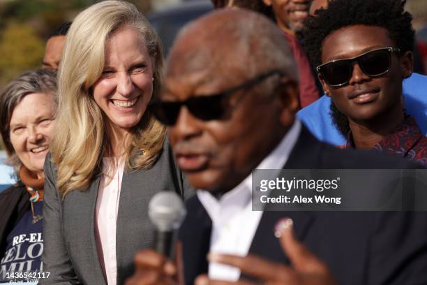 House Majority Whip Rep. James Clyburn speaks as Rep. Abigail Spanberger listens during an event outside an early voting site on October 25, 2022 in...