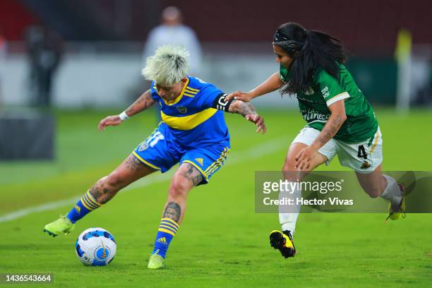 Yamila Rodriguez of Boca Juniors battles for possession with Nancy Acosta of Deportivo Cali during a semi final match of Women's Copa CONMEBOL...